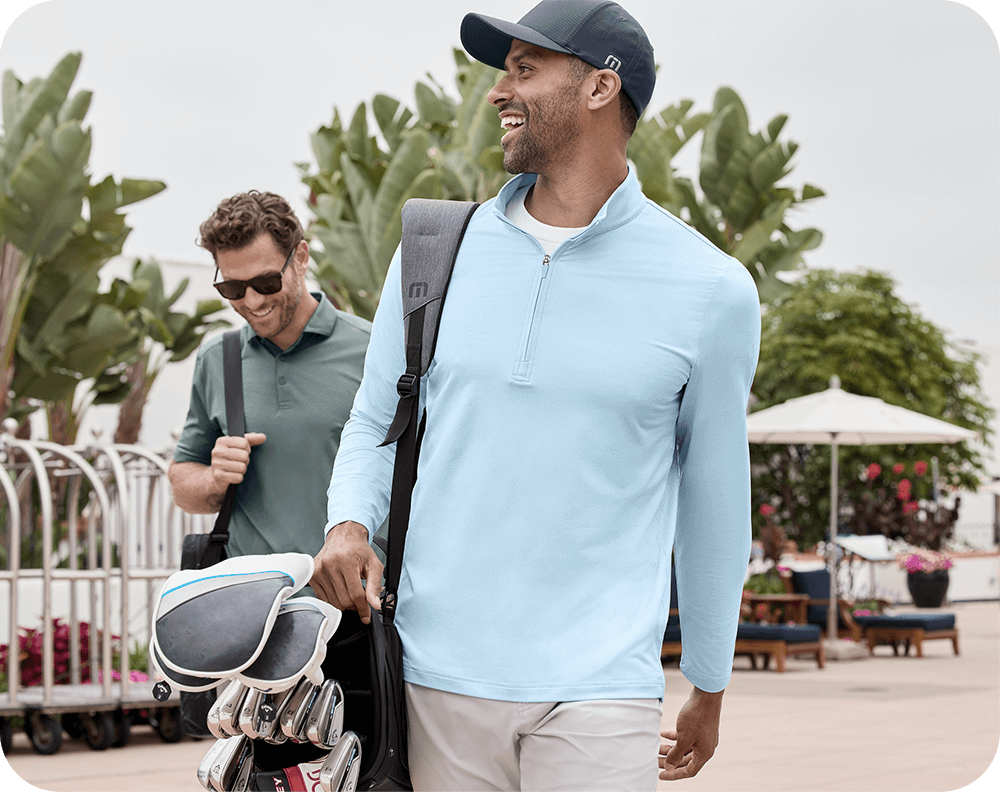 Trend-Shop_Golf Doctor holding pink breast cancer ribbon.